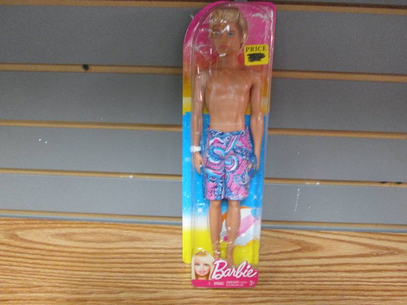 lot 129 image: Ken doll in swim gear...