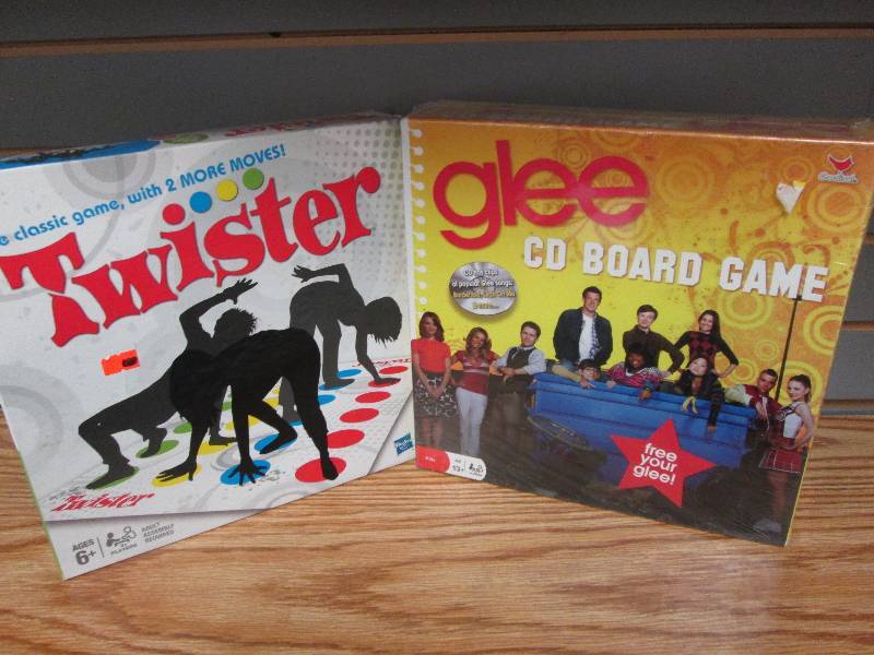 lot 159 image: Twister classic game, Glee CD board...