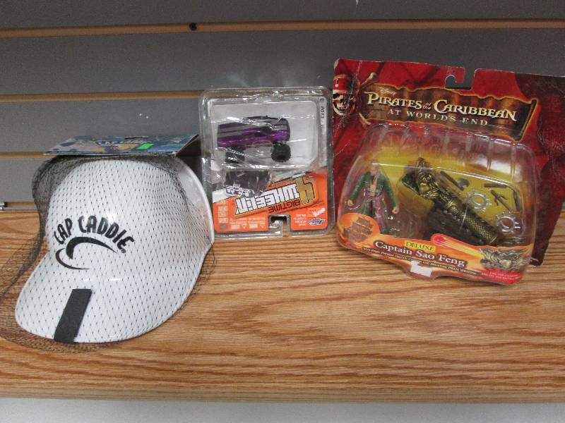 lot 182 image: Cap Caddie, Toy truck, Pirates of t...