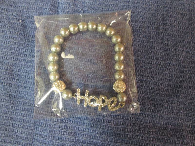 lot 14 image: Hope faux blue pearl bracelet...