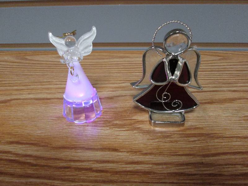 lot 24 image: Lit angel ornament with changing co...