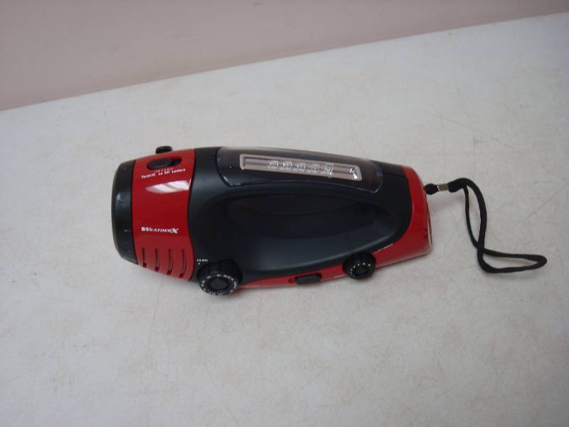lot 99 image: Emergency Radio Flashlight, New, Has Crank Fr...