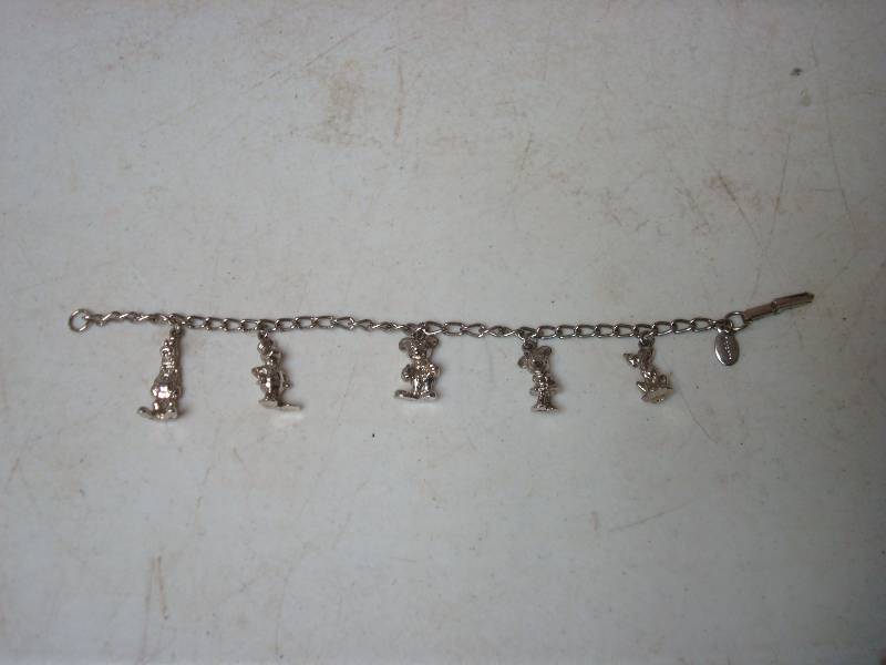 lot 102 image: Disney Character Charm Bracelet...