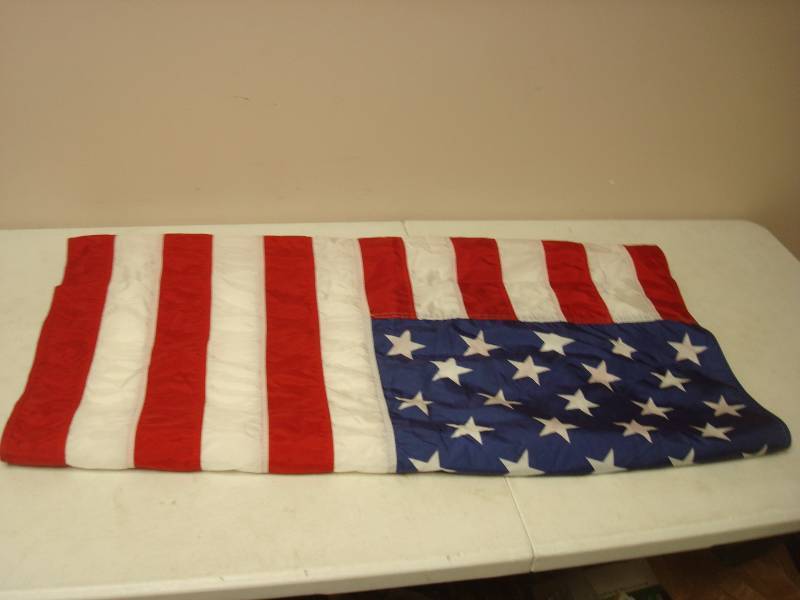 lot 126 image: Large Vinyl USA Flag, Around 78" Long...