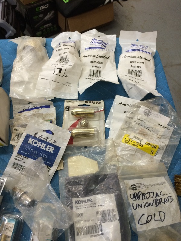 Assorted Plumbing Parts - Many in new packaging  View all pictures for more details