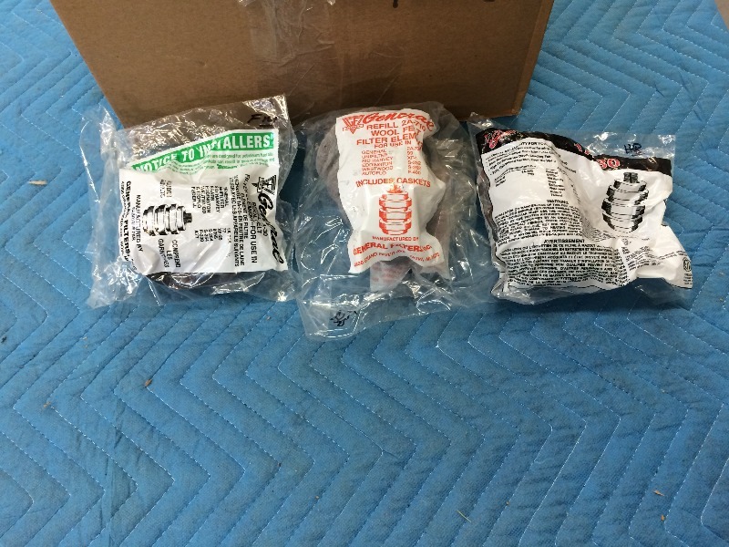 Large box of assorted oil burner filters - new in packaging  estimated at approx. 40 units