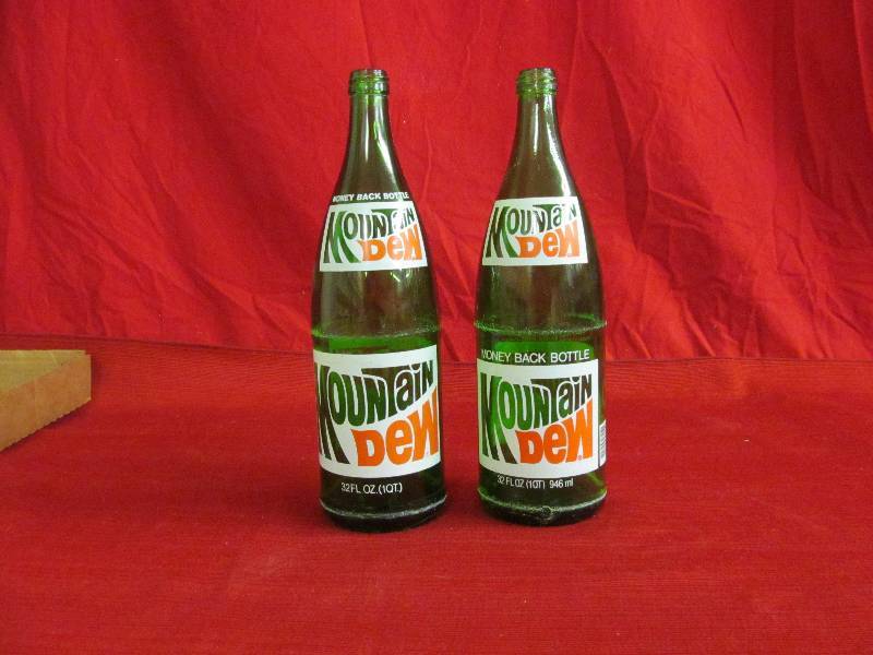lot 33 image: vintage mountain dew bottles