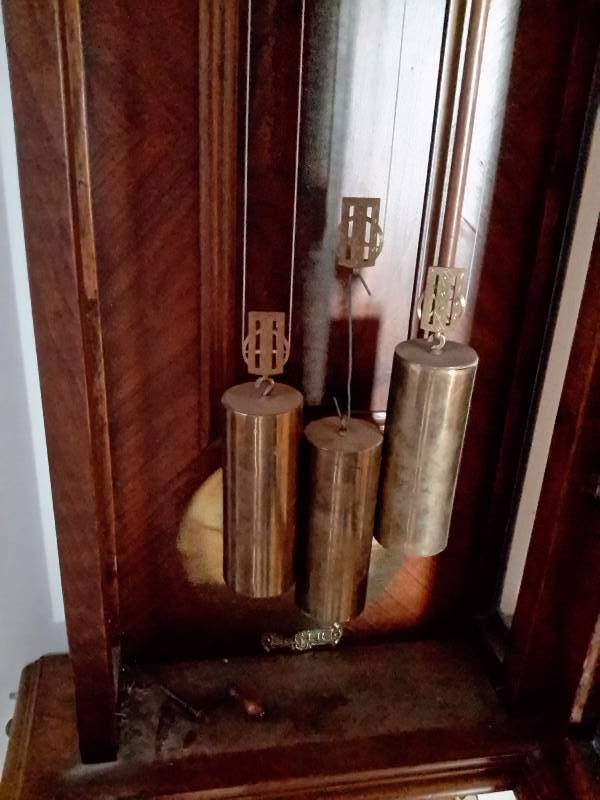 Solid wood Pendulum Wall Clock with nice Fenials and dcor.  Tested and works.. Has Crank type of key.. Nice Chimes.