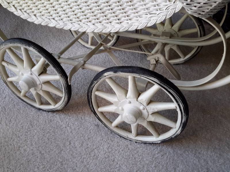 Vintage Childs Toy Baby Buggy.. Wicker with spoked wheels