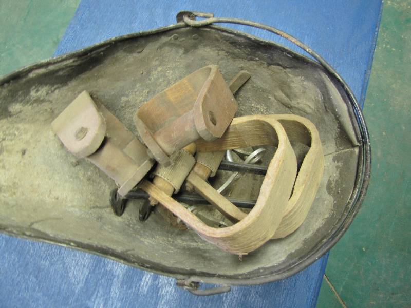 Ash Pail full of wooden stirrups