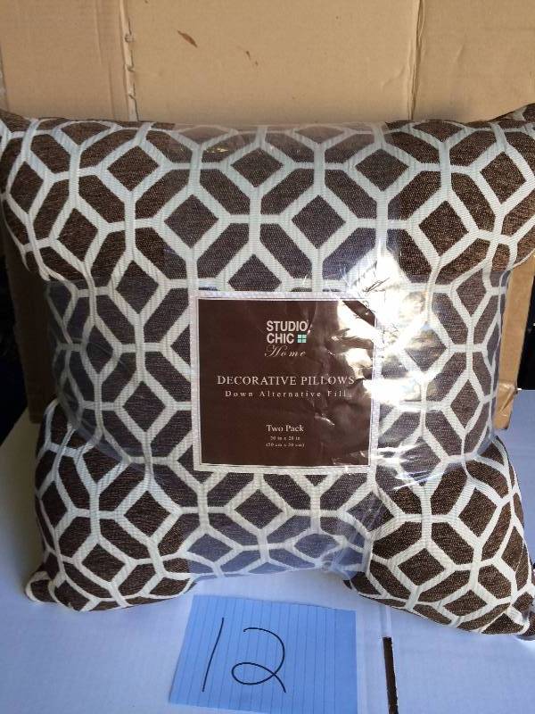 lot 12 image: Studio Chic Giraffe Bitter Fiber Pillows, Set of 2