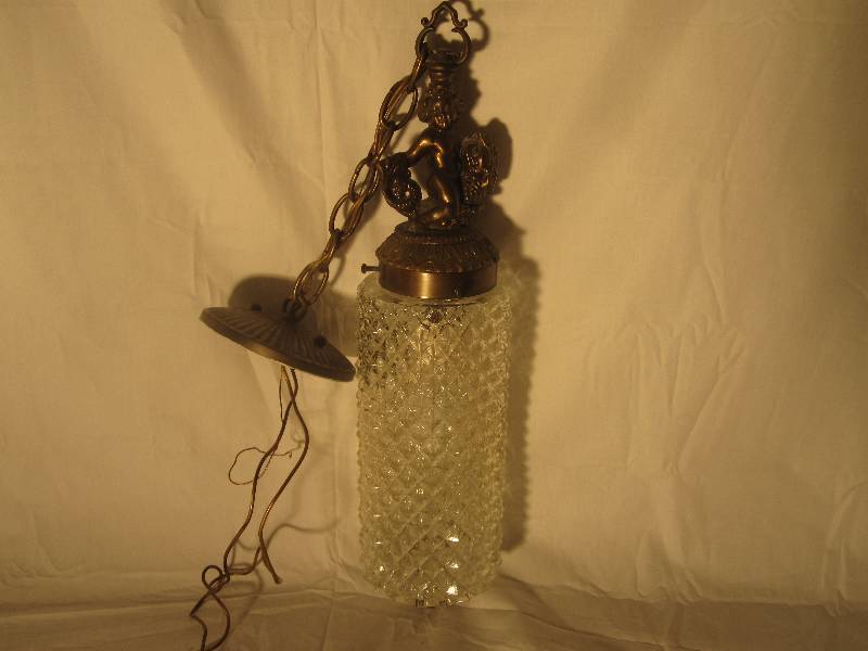 lot 8 image: Vintage brass cherub riding a fish with diamond glass shade hanging light