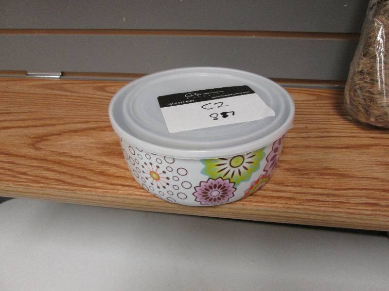 Set of 4 nested covered bowls...