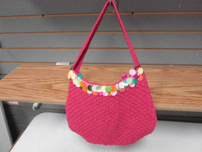 Pink woven zip spangled purse...