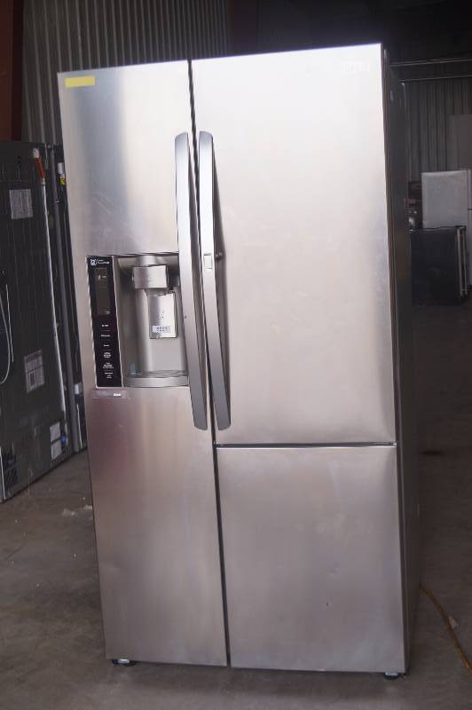 lot 1 image: LG Side by Side Refrigerator in Stainless Steel