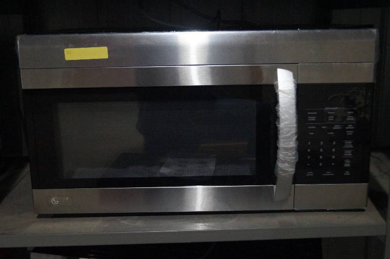 lot 21 image: Over the Range Microwave Oven in Stainless Steel