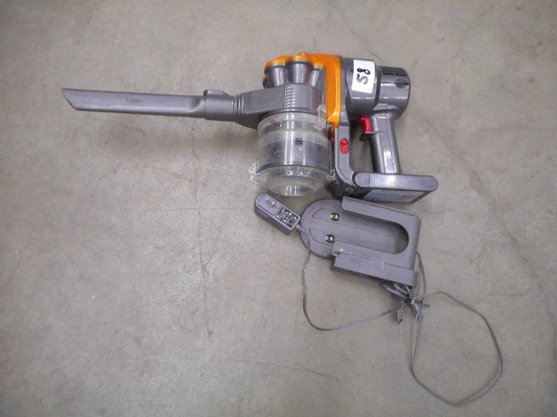 lot 58 image: Dyson Cordless Handheld Vac Set, Wo...