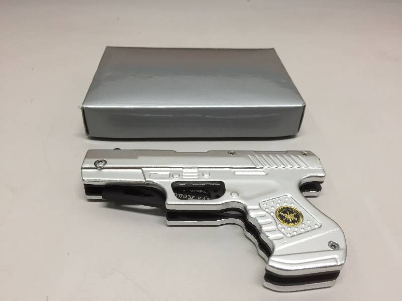 lot 19 image: PISTOL SHAPED KNIFE
