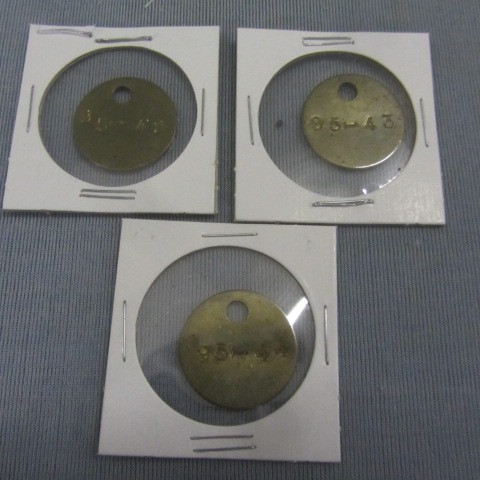 lot 223 image: Solid Brass Trappers tags