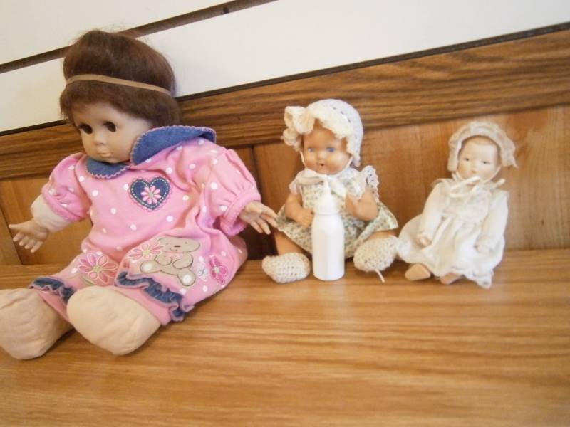 3 Dolls small one apears very old