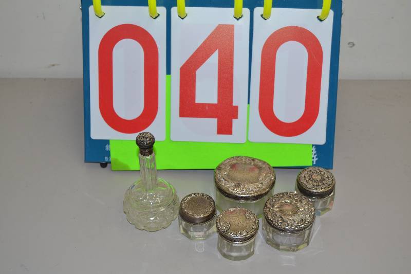 lot 40 image: Vintage Sterling topped glass containers