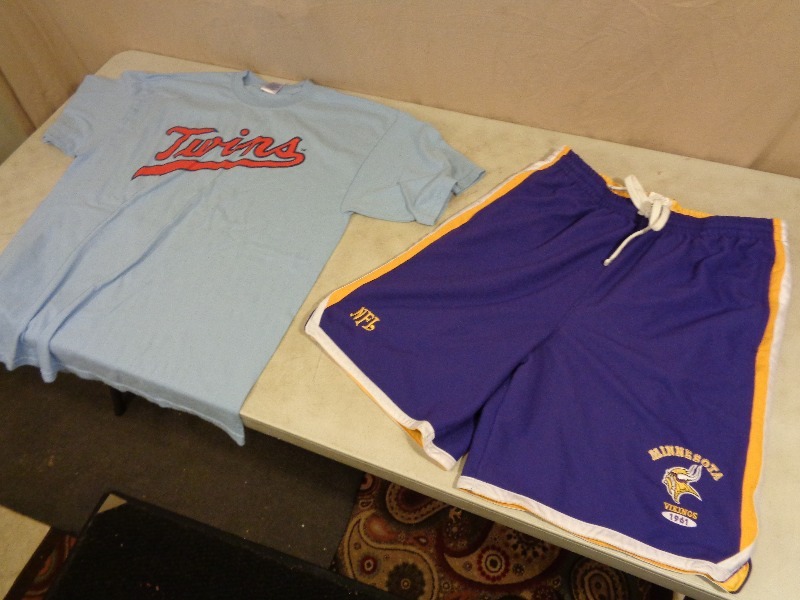 lot 51 image: XL Minnesota Twins Shirt and L Vikings Shorts