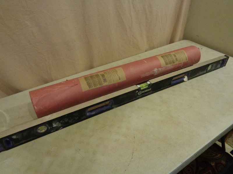lot 92 image: New Roll Red Rosin Paper and Level