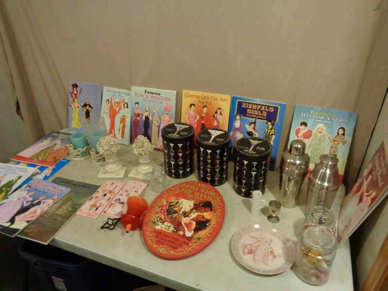 lot 211 image: Drink Shakers, Martini Glasses, Old Paper Doll Books, and More