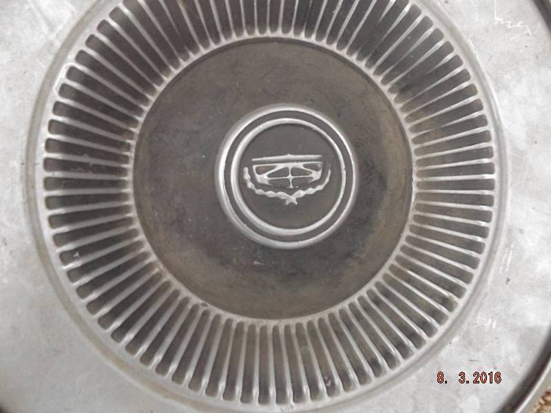 lot 16 image: 2 Misc Hubcaps
