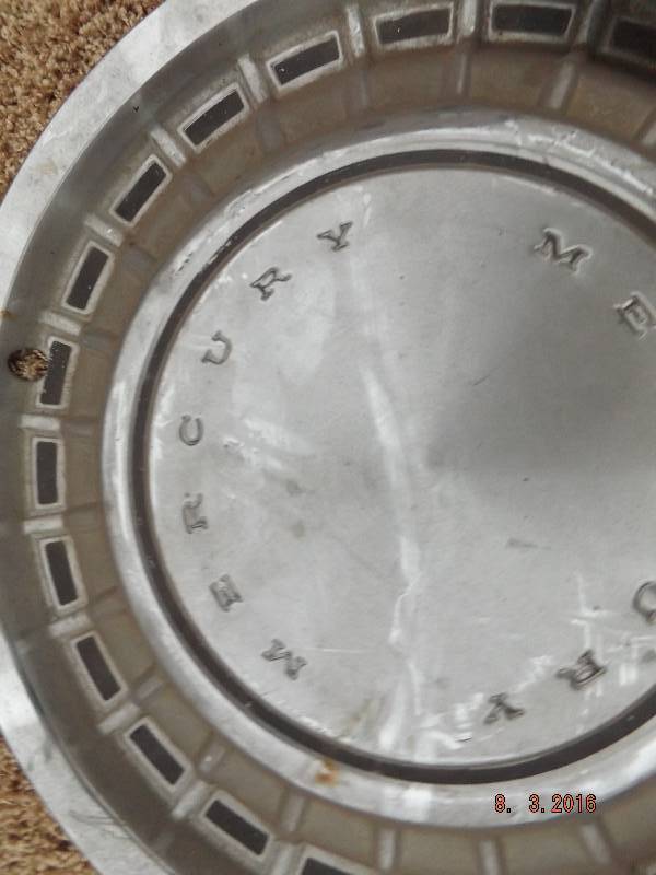 lot 22 image: 3 Misc Hubcaps