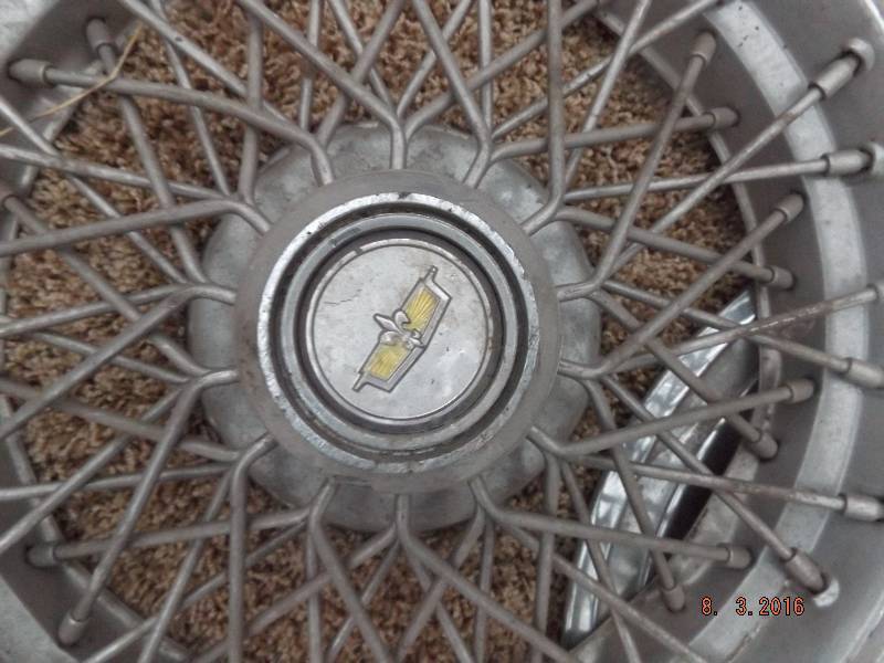 lot 24 image: 2 Misc Hubcaps