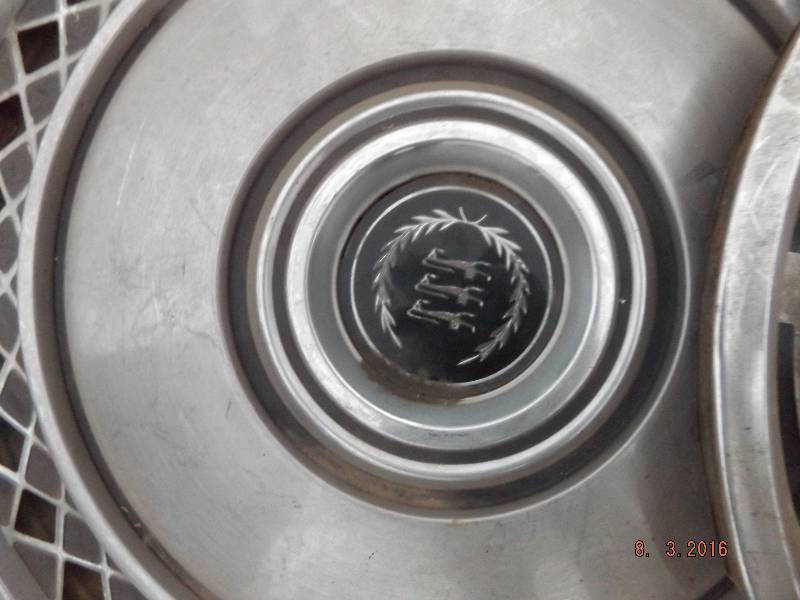 lot 25 image: 2 Misc Hubcaps