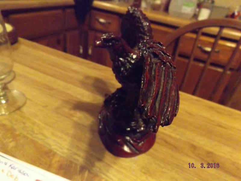 lot 90 image: Red Colored Molded Eagle