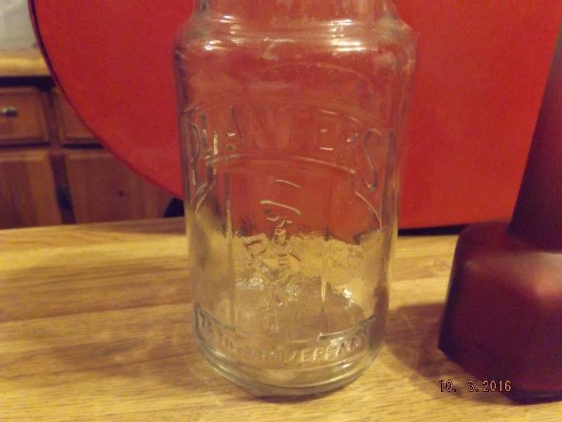 lot 94 image: Planters Peanuts Glass Jar & Bottle
