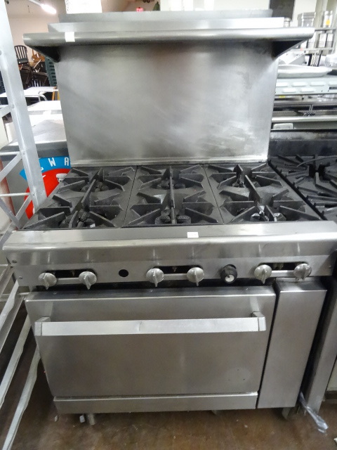 lot 109 image: 6 Burner Stove With Oven On Wheels