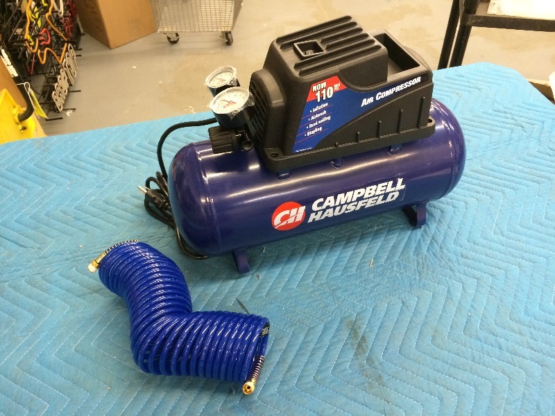lot 12 image: Campbell Hausfeld Air Compressor  3 gallon   new in box   works