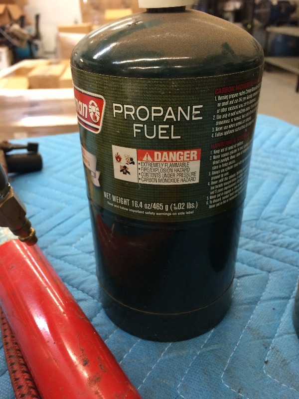 lot 129 image: Tire Pump, coleman cooking gas tanks, paint sprayer