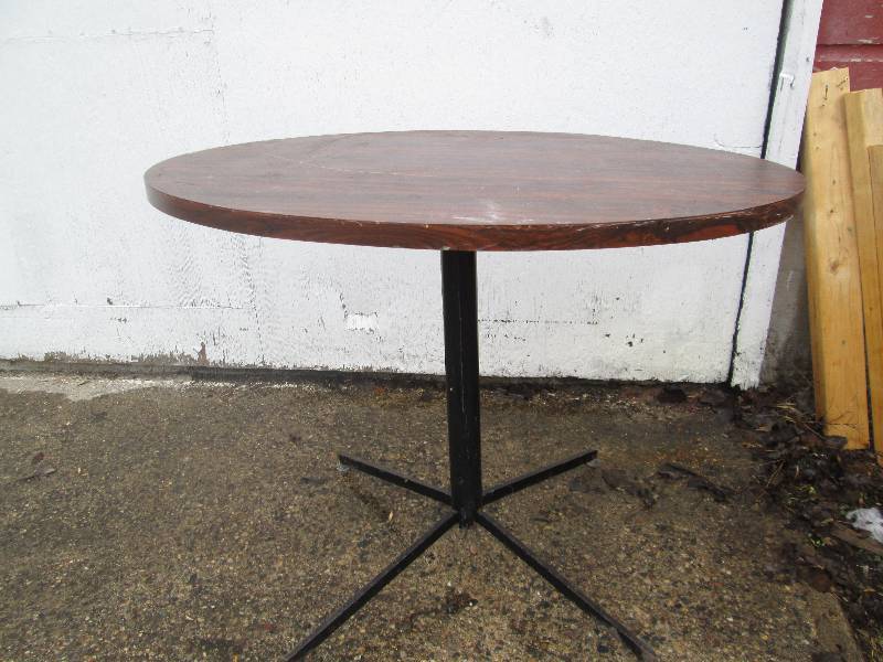 small wooden table with metal stand...