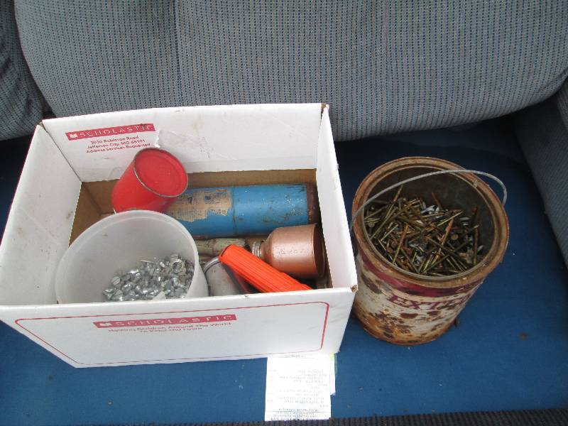 lot of tools and paint can of nails...