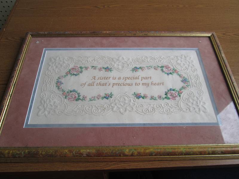 hand stiched framed sister pictures...