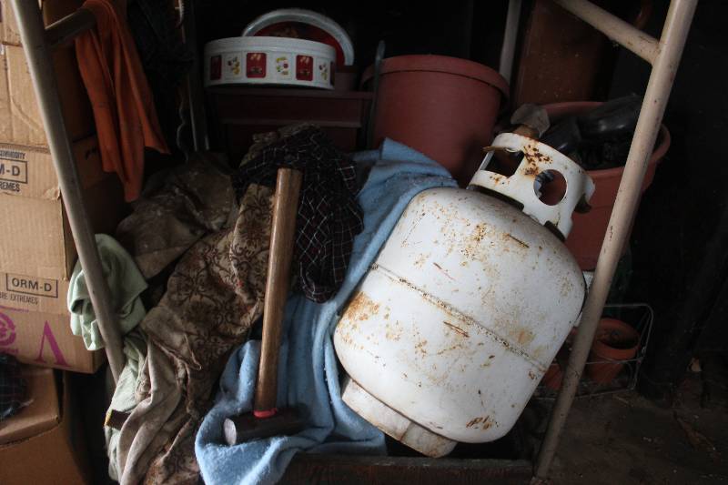 Under Shelf Lot Including Propane Tanks