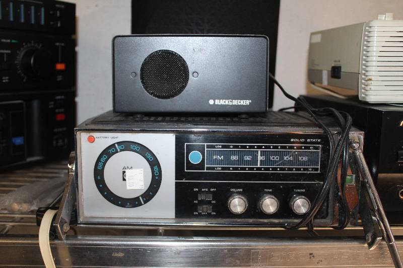 lot 37 image: Lot of (2) Electronic Equipment Including Solid State AMFM Stereo Black & Decker Speaker