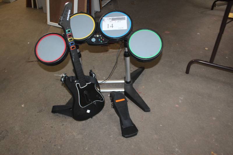 lot 14 image: Lot of (3) X-Box Accessories Including Guitar Drum Kit Pedals