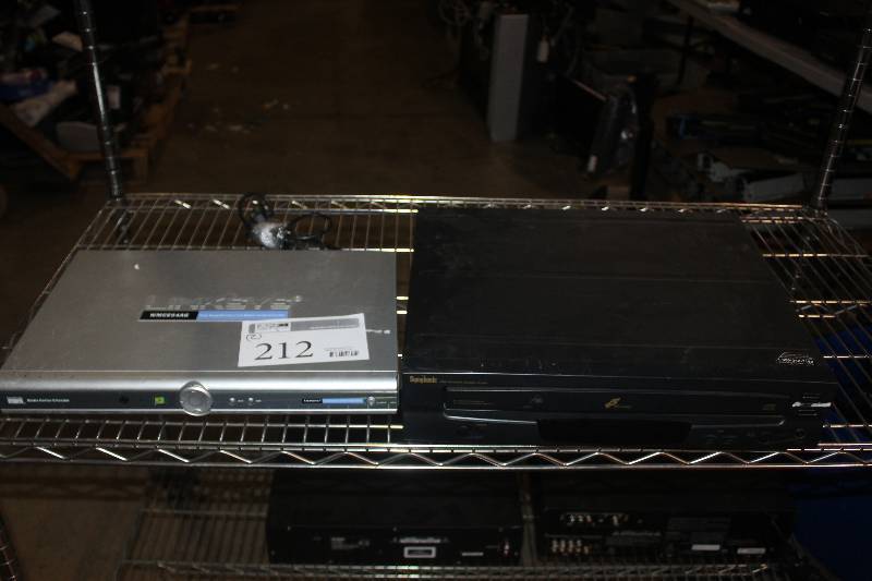 lot 212 image: Lot of (2) Electronic Equipment Including Linksys Dual-Band Wireless AG Media Center Extender Symphonic Compact Disc Player