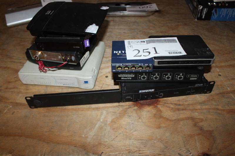 lot 251 image: Lot of (9) Electronic Equipment Including Netgear 5-port 10100 Switch Marathon MacVU Shure Digital EQ Arris Modem 3com Dual Speed Hub Kraco 40CH CB Radio Roku XD And More