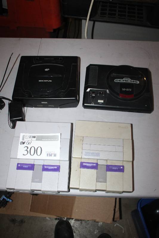lot 300 image: Lot of (4) Electronic Equipment Including Sega Genesis Console 2-Super Nintendo Consoles Sega Saturn Console