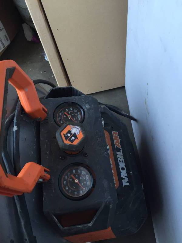lot 49 image: Ridgid 6 Gal. Portable Vertical Pancake Air Compressor for parts or repair