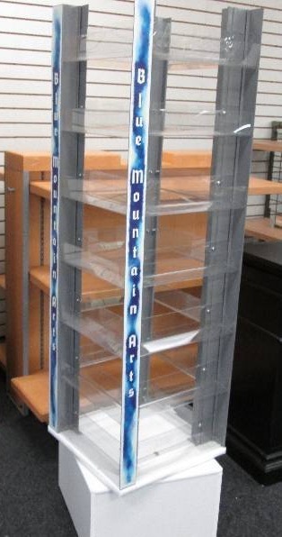 Revolving card shelf  on white pede...