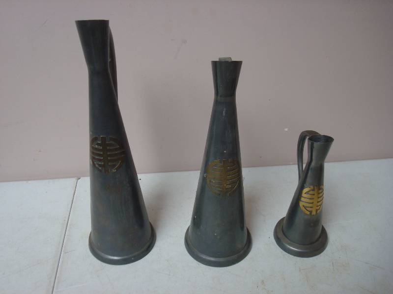 lot 50 image: Three Metal Asian Themed Pitchers
