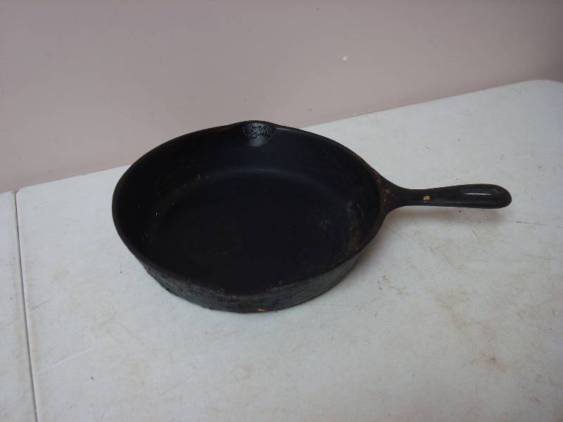 lot 70 image: Medium Sized Cast Iron Pan, Shows Wear